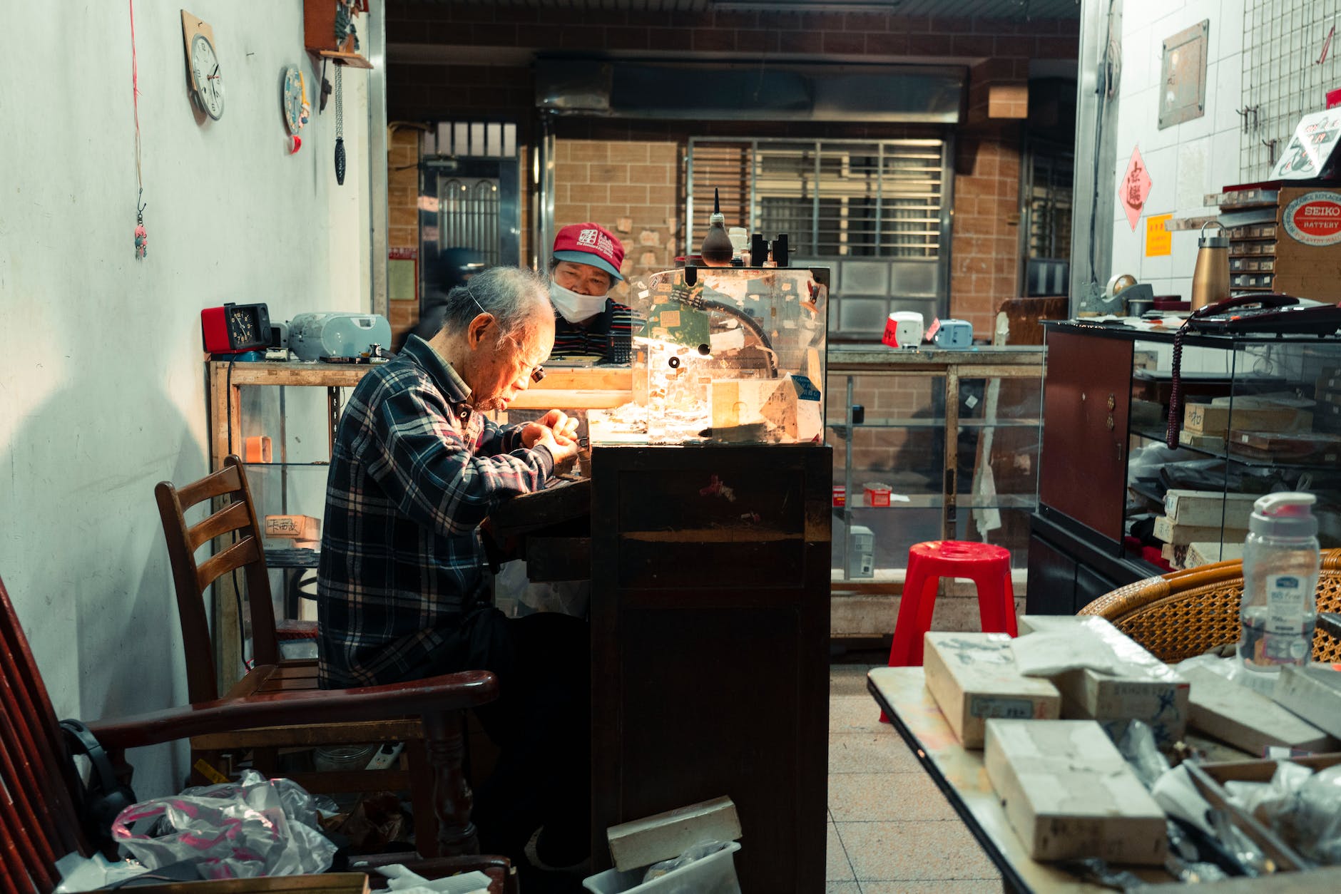 elderly man working in a workshop