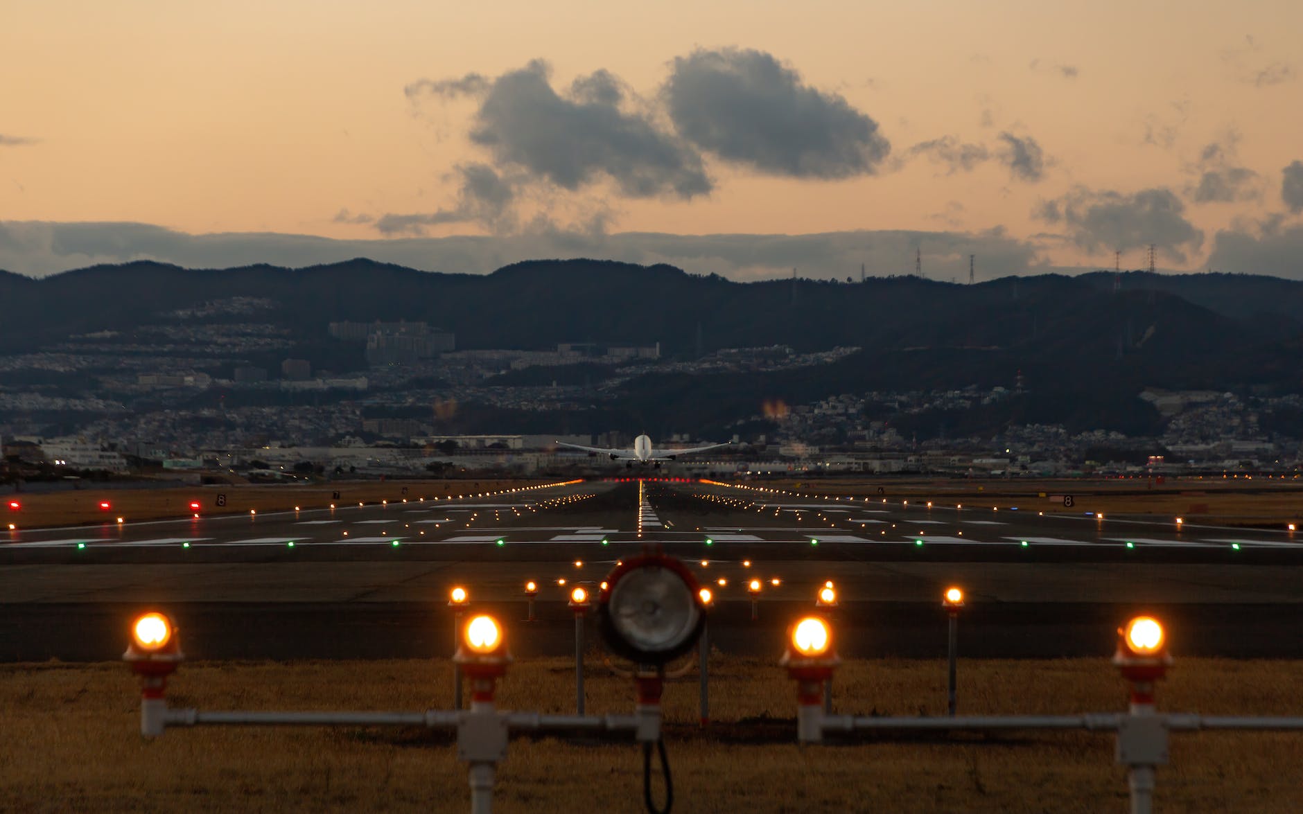 photo of airplane flying from runway